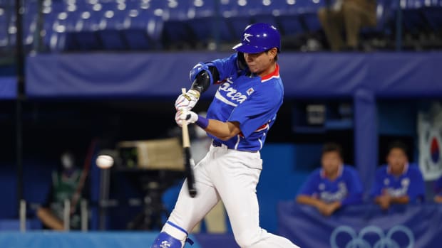 Jul 31, 2021; Yokohama, Japan; Team South Korea outfielder Jung Hoo Lee (51) hits a single against USA during the Tokyo 2020 Olympic Summer Games at Yokohama Baseball Stadium. Mandatory Credit: Yukihito Taguchi-USA TODAY Sports  
